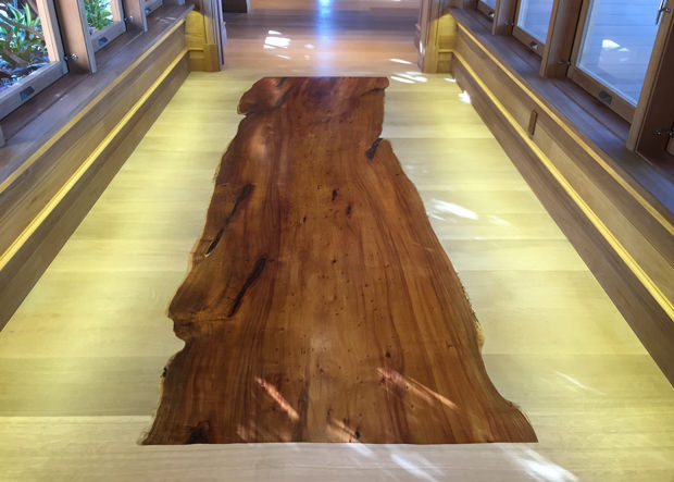 Rift Sawn White Oak flooring bordering wood slab